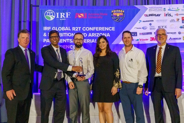 From left to right: IRF CEO Patrick Sankey, ASU School of Sustainable Engineering and the Built Environment Director Ram Pendyala and the ASU research team: Carlos Obando, Jolina Karam, Jose Medina and Kamil Kaloush. Photo courtesy of the 2023 Arizona Pavements and Materials Conference by Dubeyscape