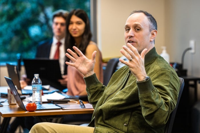 A man talks in a classroom