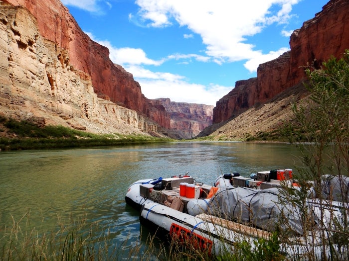 An image of the Colorado River and a boat taken during a river trip through the Grand Canyon.