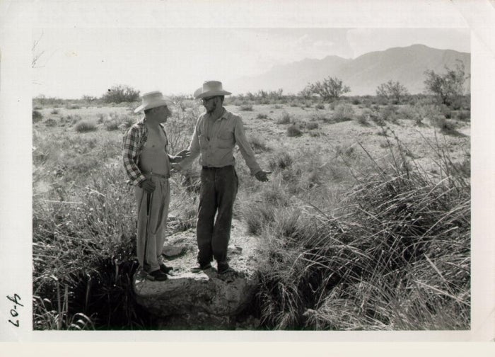 Two men in an old black-and-white photograph.