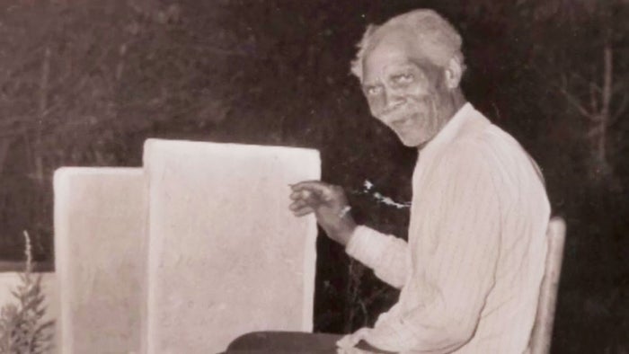 An antique photograph of a tombstone carver