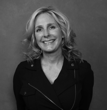 Black and white portrait of woman with curled blonde hair