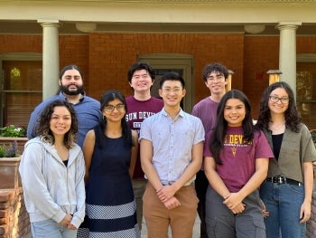 Group of students standing in front of a building