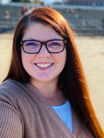 Woman with glasses smiling