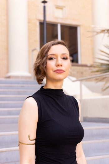 Portrait of woman with short brown hair wearing black blouse