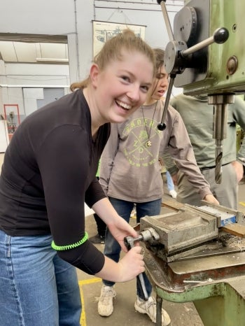  Kathleen Myers-Haeussler  operates a drill press at the Addis Ababa Institute of Technology.