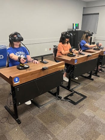 GateWay Community College staff participate in a demonstration of the Dreamscape Learn virtual reality classroom. Computing Commons, Tempe campus.