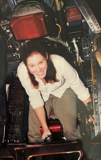 Missy Brost sitting in a live cockpit of an SR-71 while participating in NASA's work-study (co-op) program.