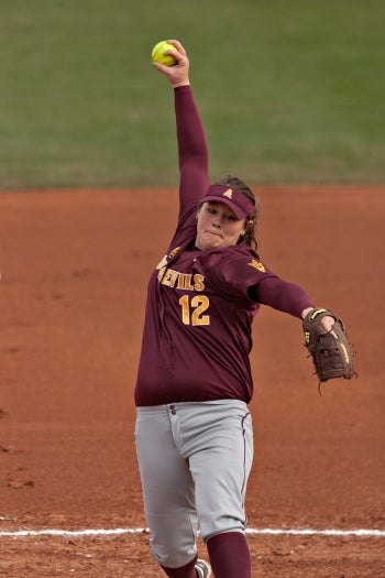 woman pitching a softball