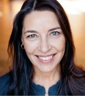 Portrait of woman with blue eyes and long black hair