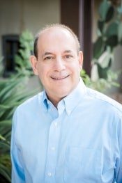 Portrait of man wearing blue collared shirt