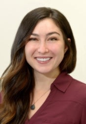 Dr. Rachael Maddox smiles into the camera while showing off her pearly whites