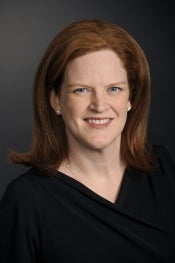 Woman with red hair smiling