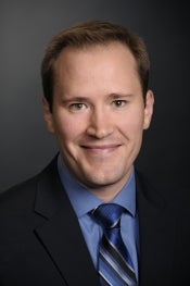 Man in tie smiling