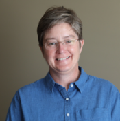 Rebecca Sandefur smiling in a blue shirt