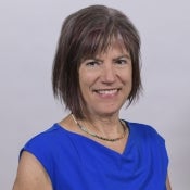 Headshot of Nancy Grimm wearing a blue shirt