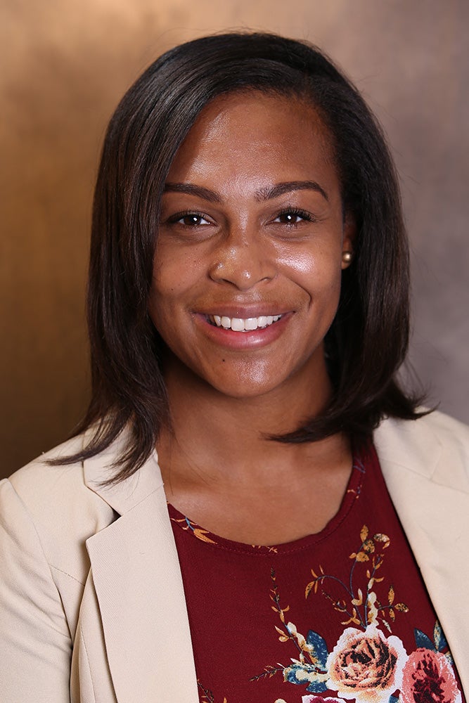 Woman in a creme colored jacket