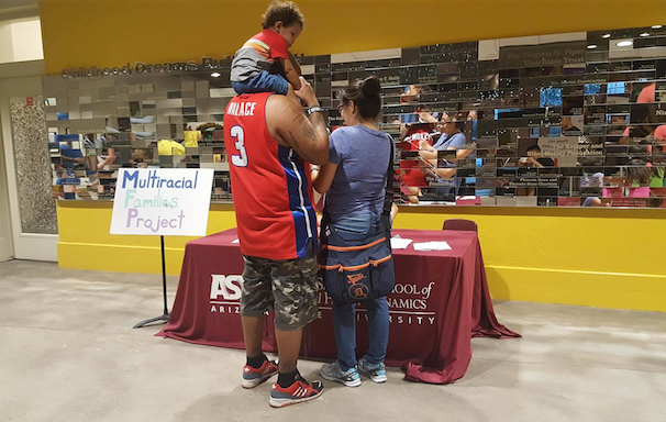 Picture of another family at the recruiting table.