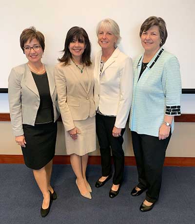 A group of women pose for a photo