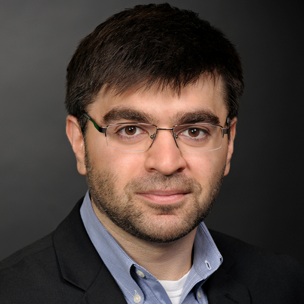 Man in glasses wearing jacket and shirt