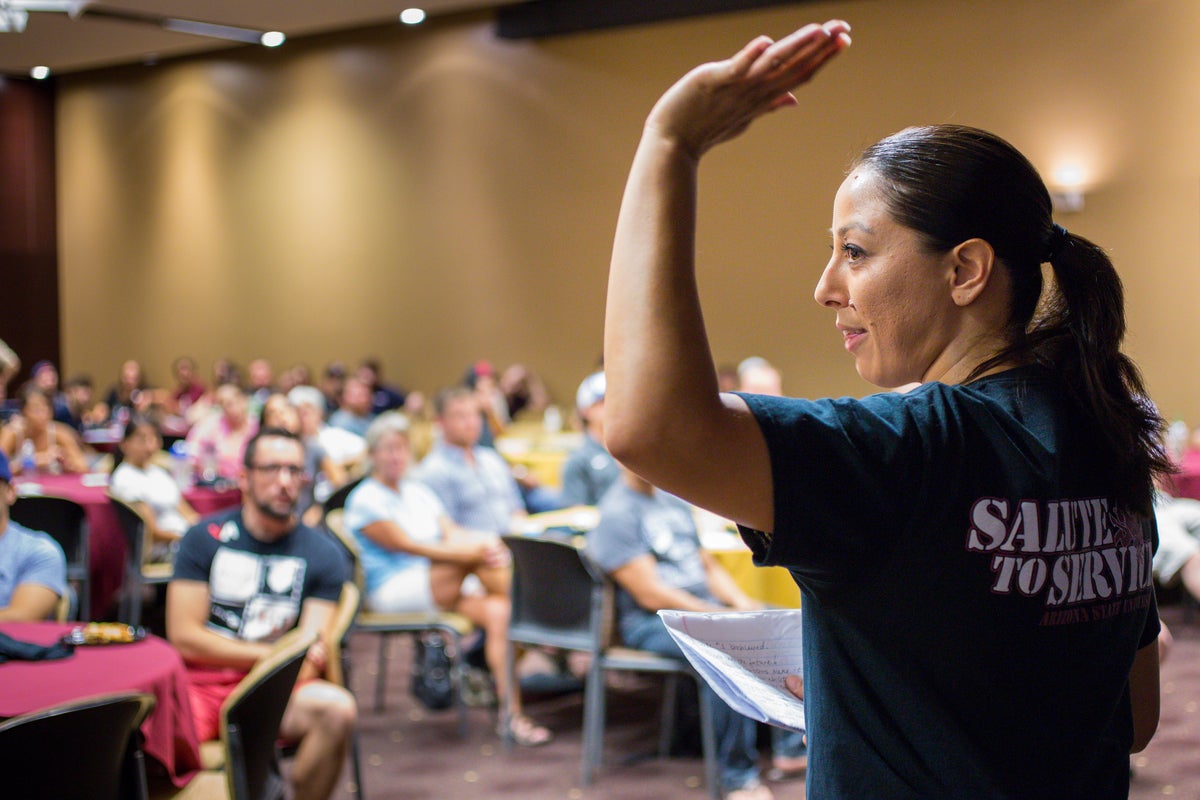 Woman addresses room