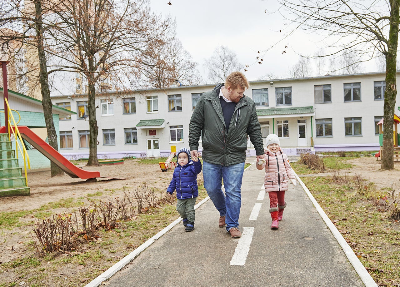 ASU McCain scholar Yaroslav Bekish walks with his children