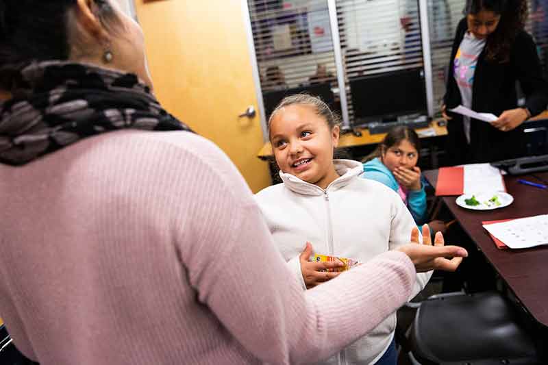 ASU professor Maria Silva talks about healthy food choices at a local YMCA