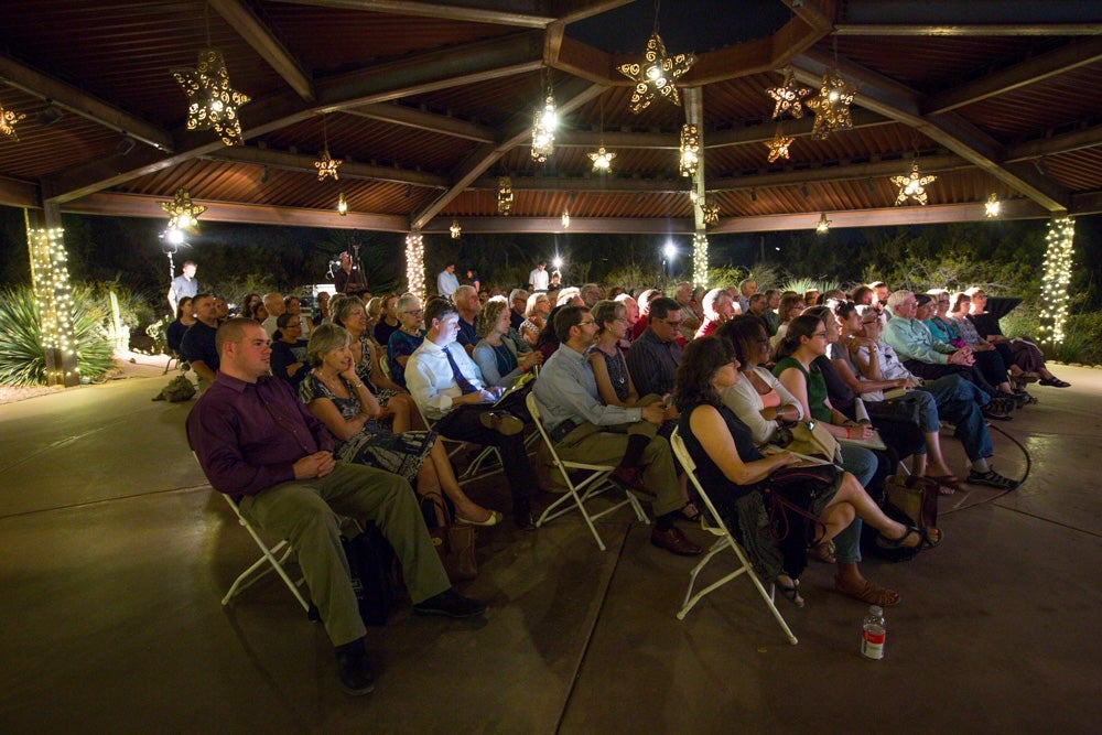 A Zocalo Public Square audience sits under a large gazebo at Desert Botanical Garden.